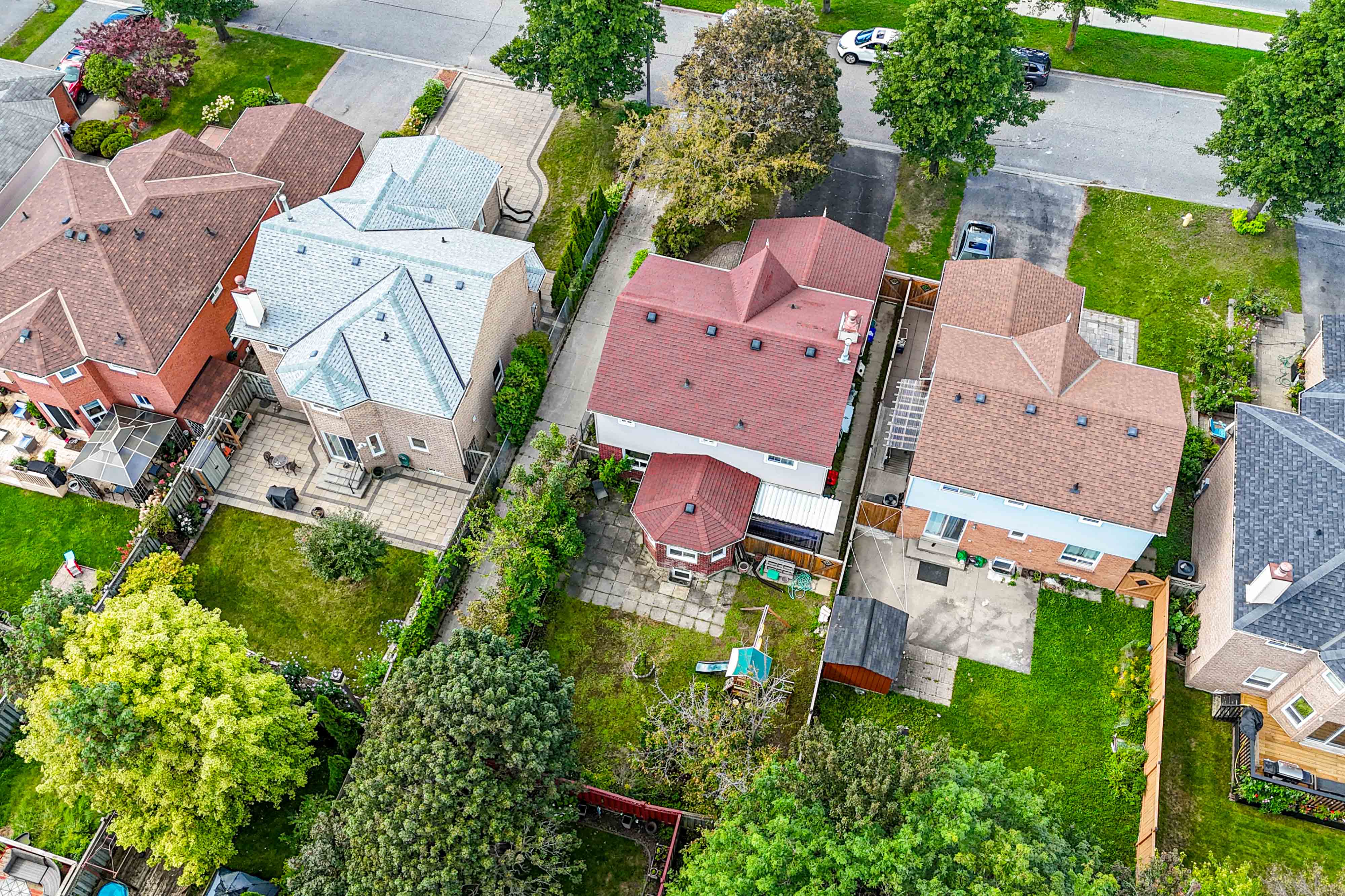 Aerial view of backyard and red roof property